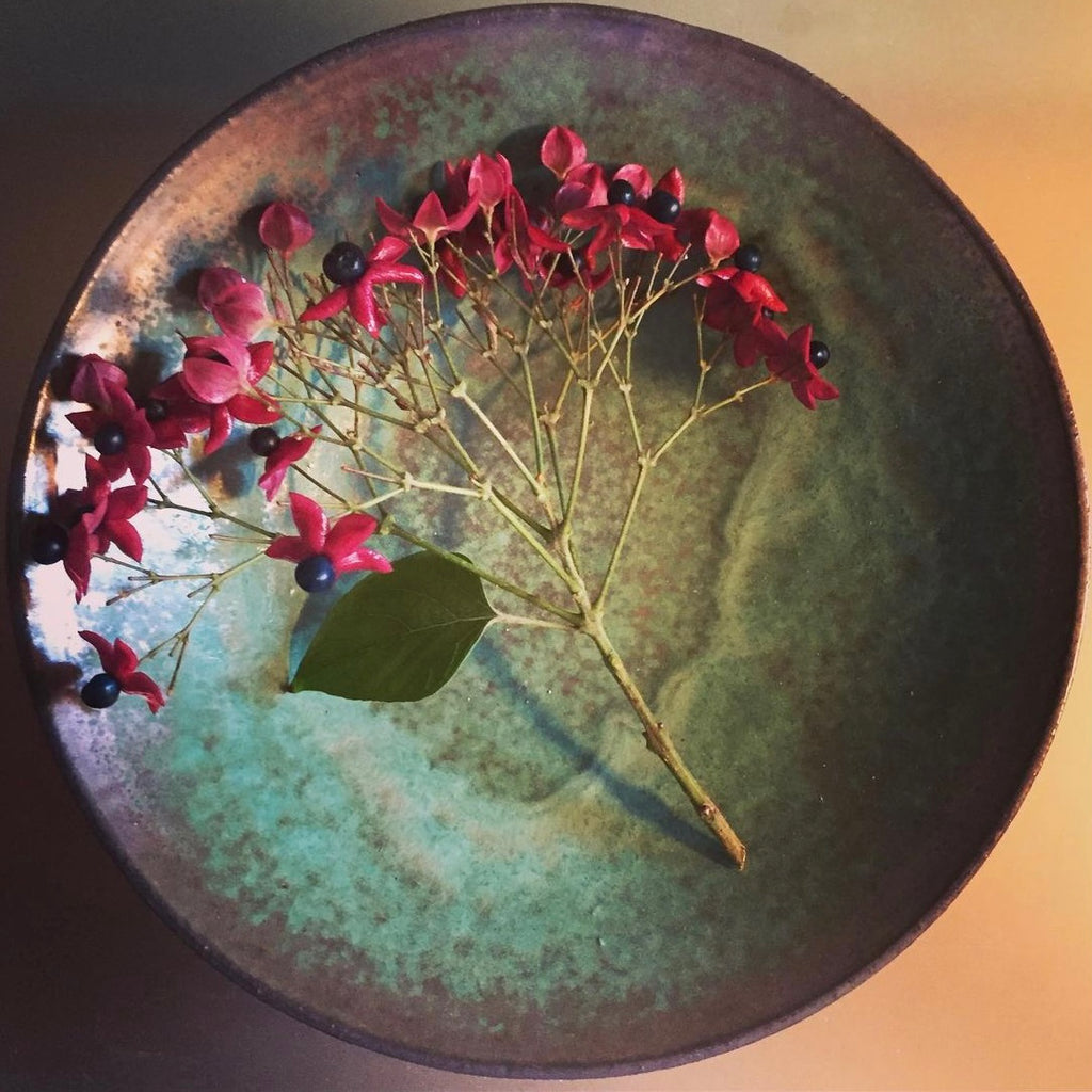 GREEN OVER GLAZE ON BLACK BOWL